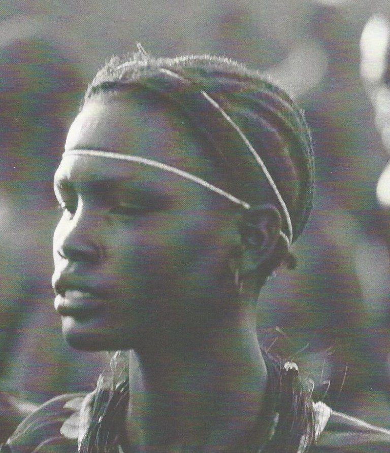 Side view of individual with ornaments