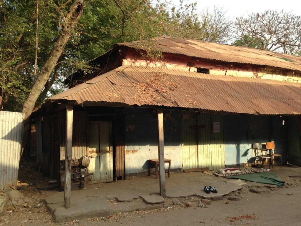 Weathered building surrounded by trees