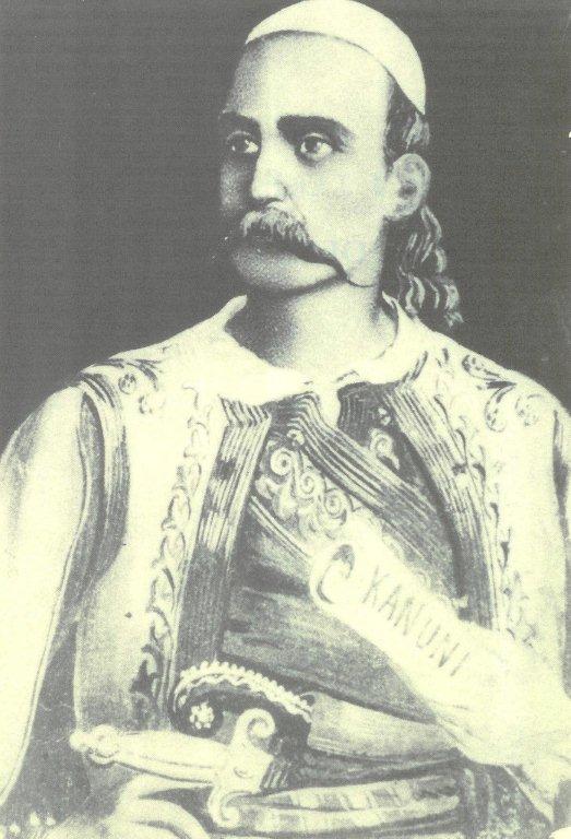 Man in traditional attire with mustache