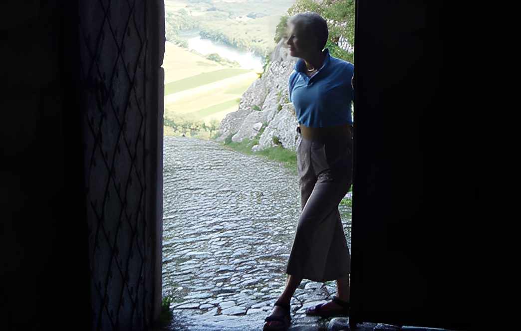 Silhouette of person exiting building